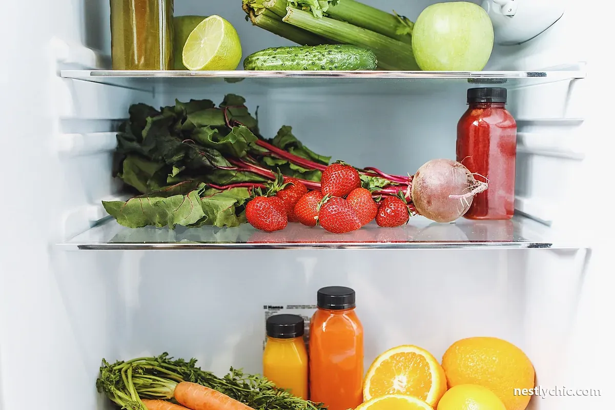 Fresh fruit and vegetables inside a refrigerator