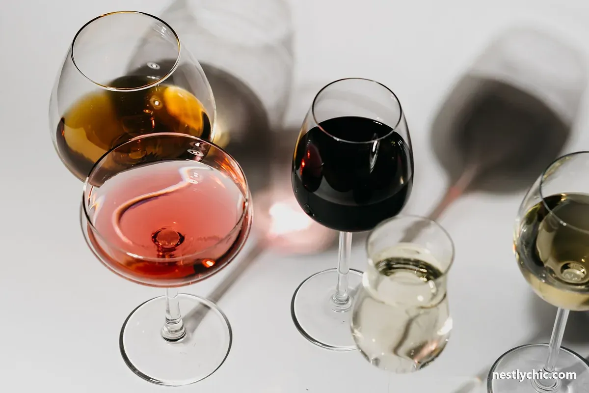 Different wine glass shapes on a white surface