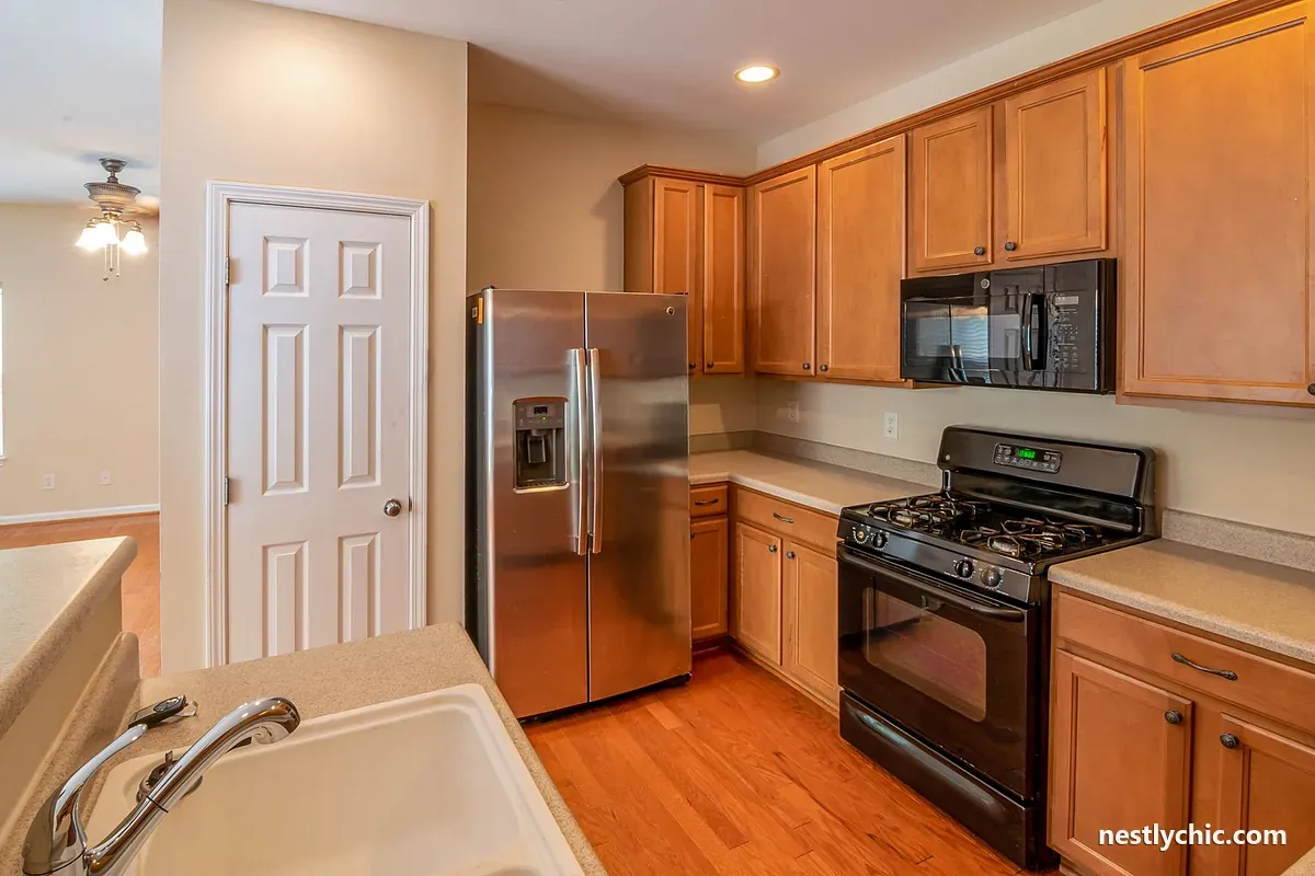 Kitchen with a stainless steel refrigerator