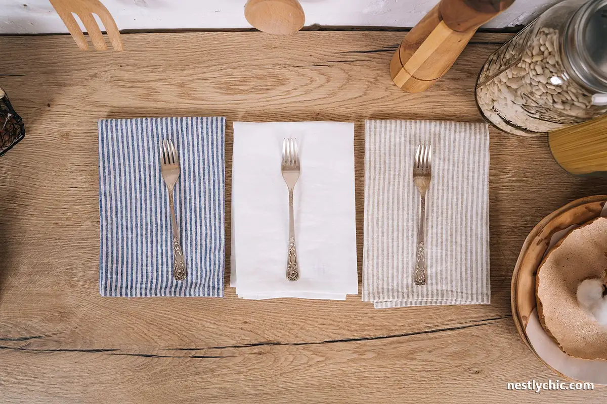 Cutlery on striped kitchen towels