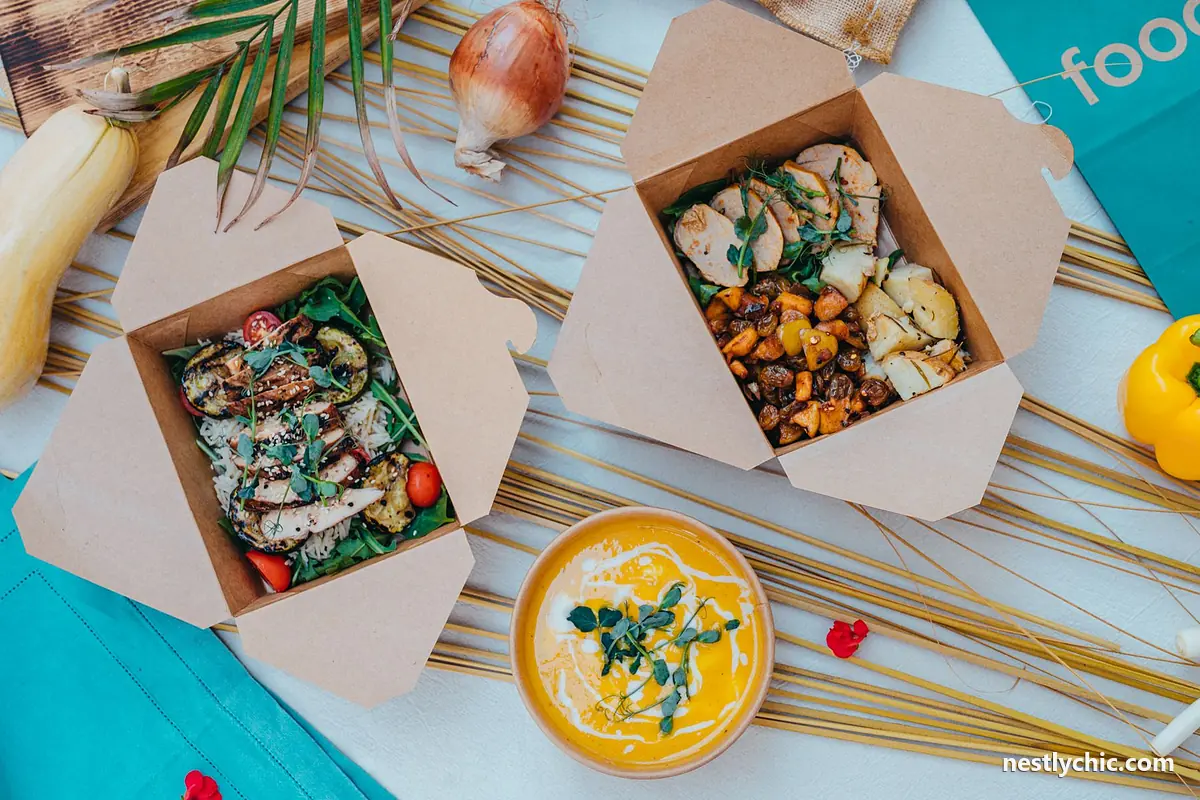 Takeout containers with salad and soup