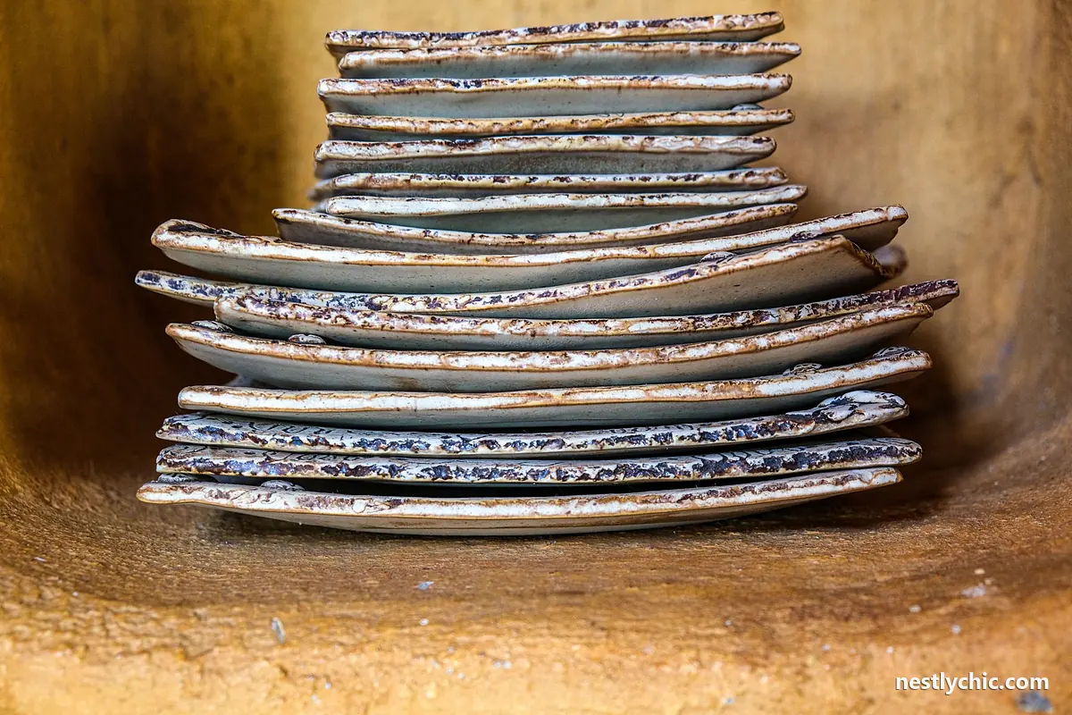 A stack of vintage rustic glazed ceramic plates