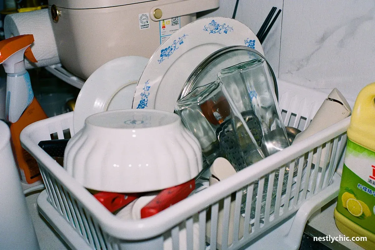 Clean plates and glasses drying in a dish rack